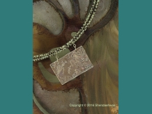 Records of the past, reproductions of Southwestern rock arts, pendant by Shendaehwas